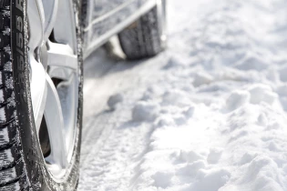 Car driving through the snow