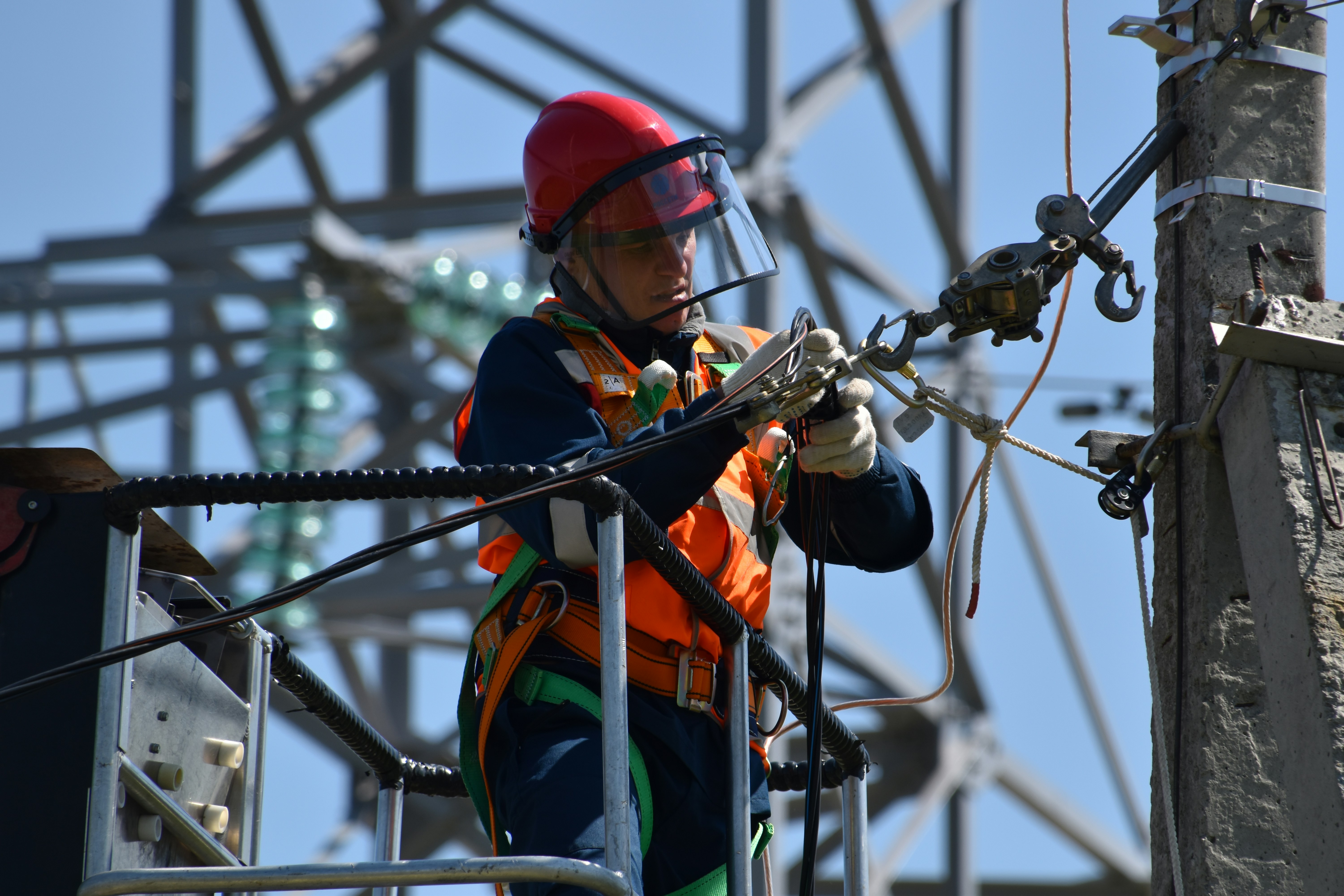 construction worker working on an electric power line